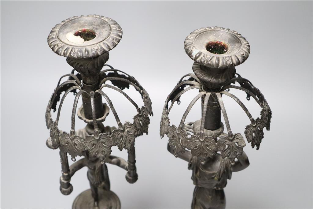 Two early 19th century bronze figural candlesticks (lacking glass lustres), 37.5cm